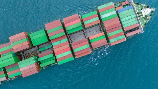 Aerial View Of A Container Cargo Ship On The Sea. Cargo And Ship
