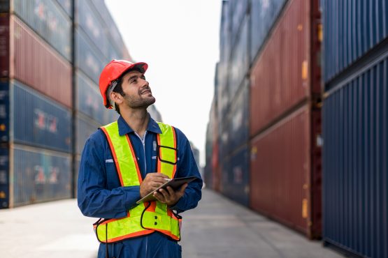 Foreman Or Worker Work At Container Cargo Site Check Up Goods In